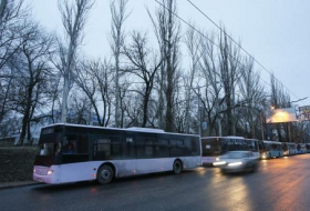 Ukrainian, rebel convoys head for rail town to evacuate civilians